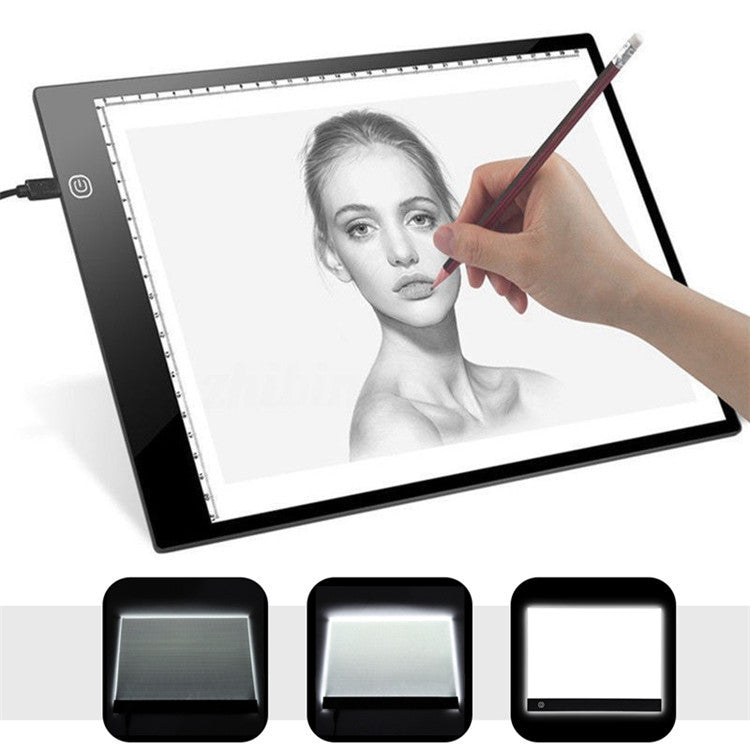 Artist at work on portrait LED Light Drawing Board